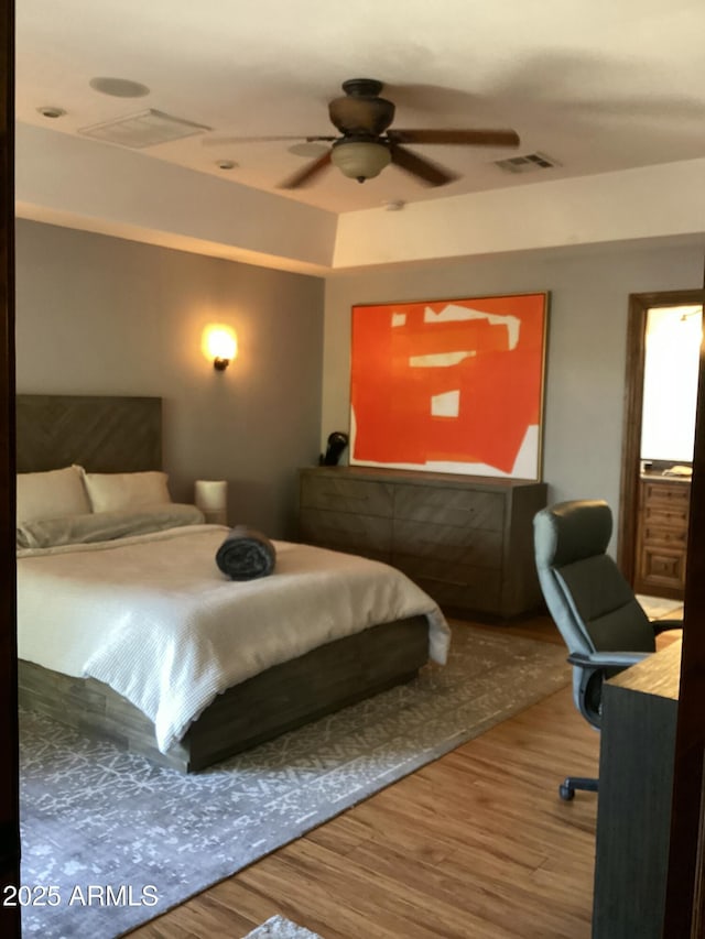 6540 E Wildcat Dr, Cave Creek, AZ 85331 - bedroom with wood finished floors and ceiling fan