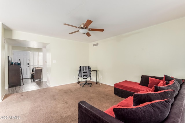 living room with carpet floors and ceiling fan