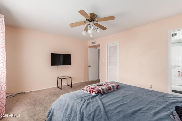 bedroom with ceiling fan, light colored carpet, and a closet