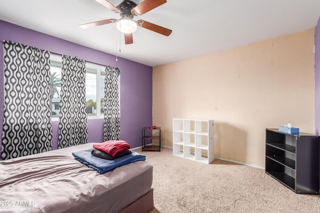 bedroom with ceiling fan and carpet