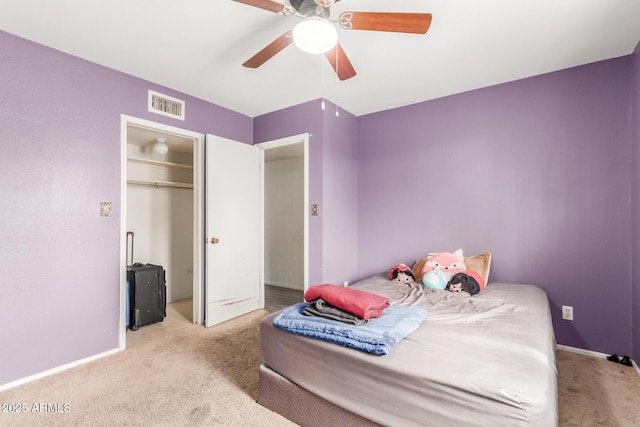 bedroom with light carpet and ceiling fan