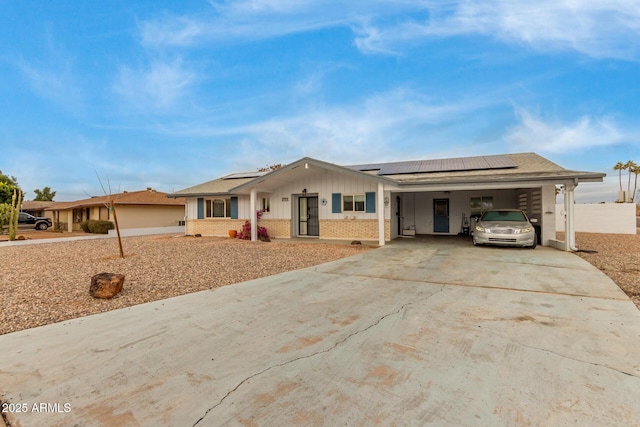 ranch-style home featuring a carport