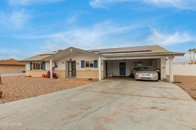 ranch-style home featuring a carport