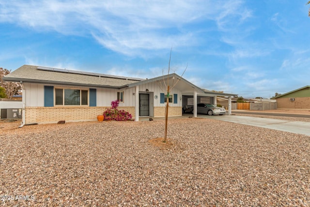 ranch-style house with a carport