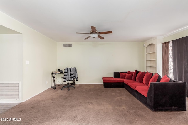 living room featuring carpet flooring and ceiling fan