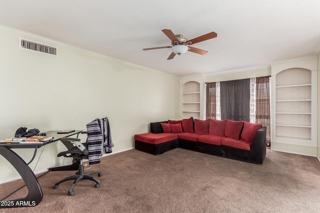 carpeted living room with built in features and ceiling fan