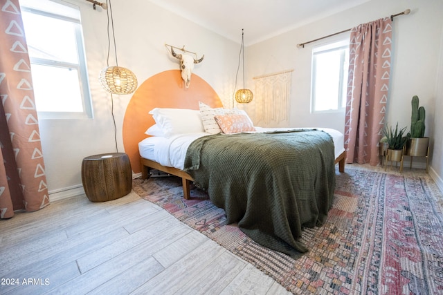 bedroom with wood-type flooring