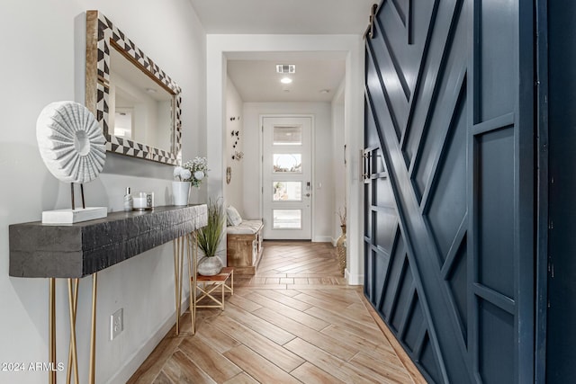 foyer with light parquet flooring