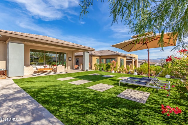 exterior space featuring outdoor lounge area and a patio