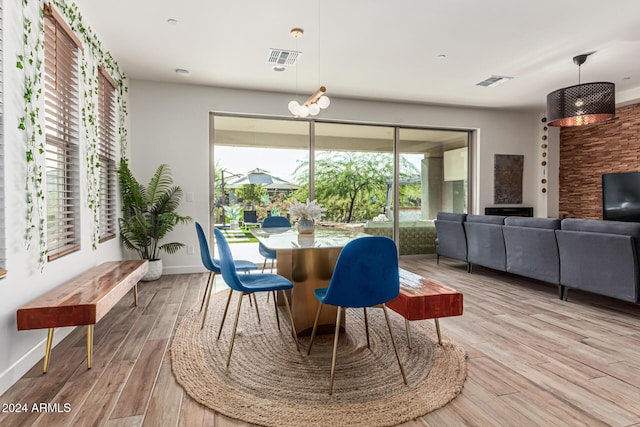 dining space featuring light wood-type flooring