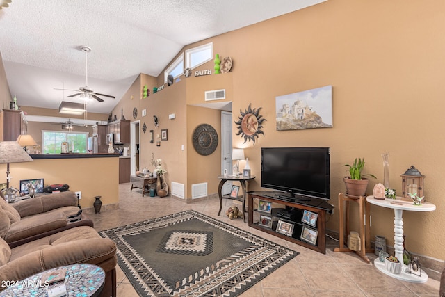 tiled living room featuring a textured ceiling, high vaulted ceiling, and ceiling fan