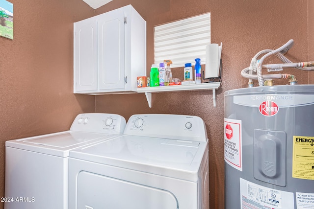 laundry room with cabinets, water heater, and independent washer and dryer