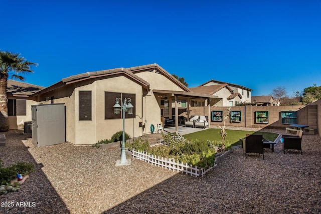 view of front of property featuring a patio area and cooling unit