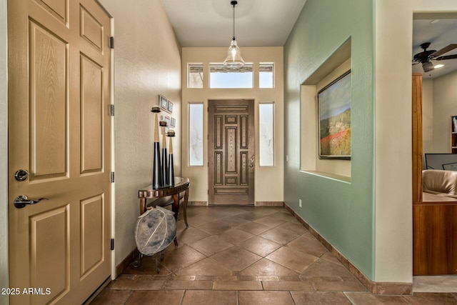 foyer featuring ceiling fan