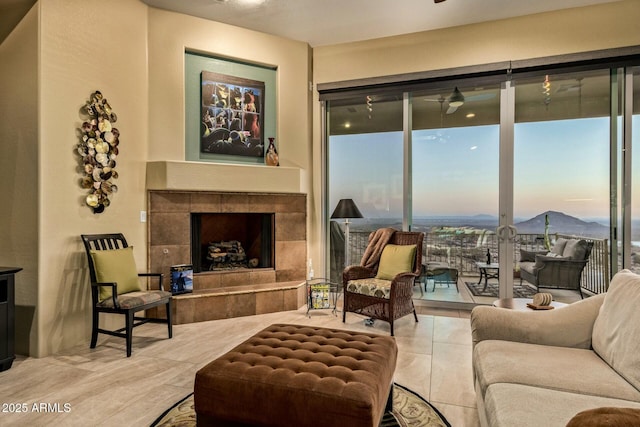 living room with a tiled fireplace