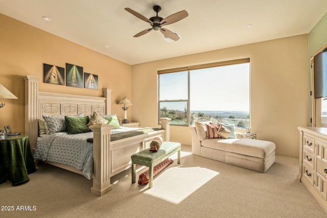 bedroom with light carpet and ceiling fan