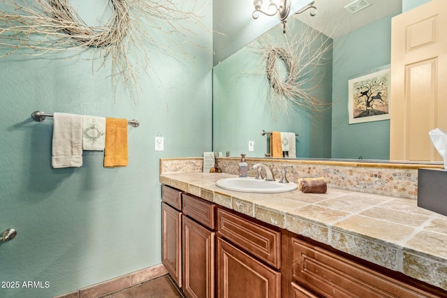 bathroom featuring tile patterned flooring and vanity