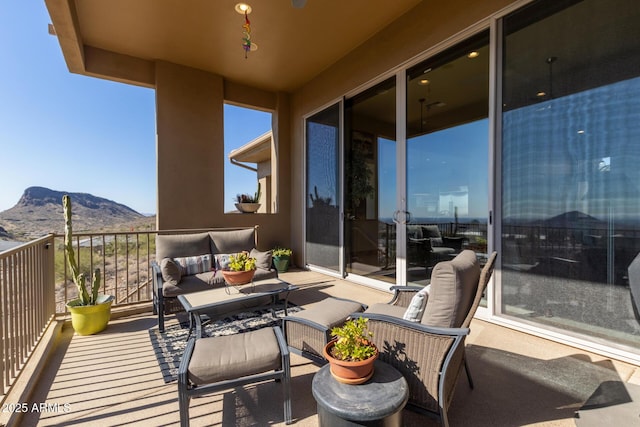 balcony featuring a mountain view