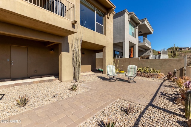 rear view of property featuring a patio area