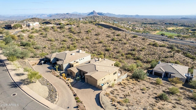 birds eye view of property featuring a mountain view