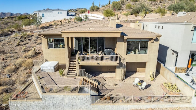 back of house with a patio area