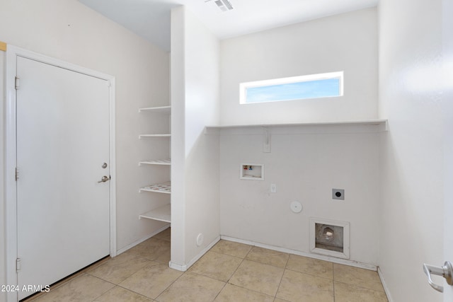 laundry area with hookup for a washing machine, light tile patterned floors, hookup for an electric dryer, and gas dryer hookup