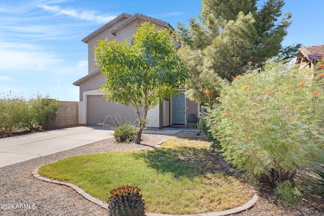 obstructed view of property with a garage