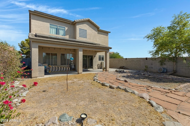 rear view of property with a patio