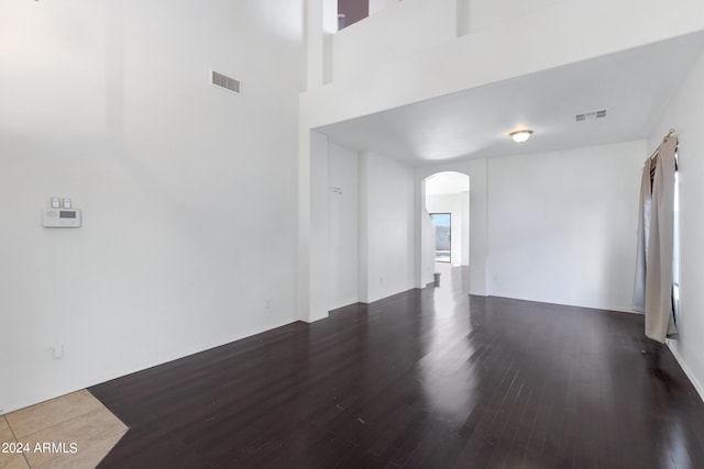 spare room featuring dark hardwood / wood-style floors