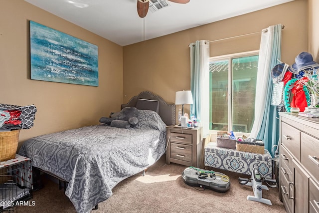 bedroom featuring visible vents, a ceiling fan, and carpet floors