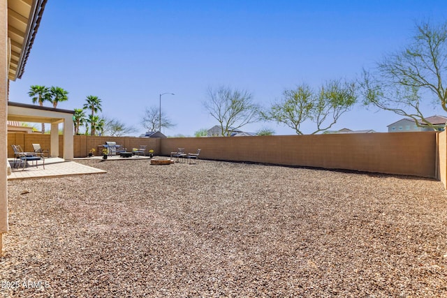 view of yard featuring a fenced backyard and a patio