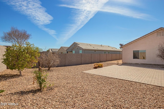 view of yard with a patio area and a fenced backyard