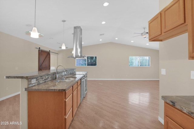 4112 N 4th Ave, Phoenix, AZ 85013 - kitchen with island range hood, a sink, a barn door, light wood-type flooring, and ceiling fan