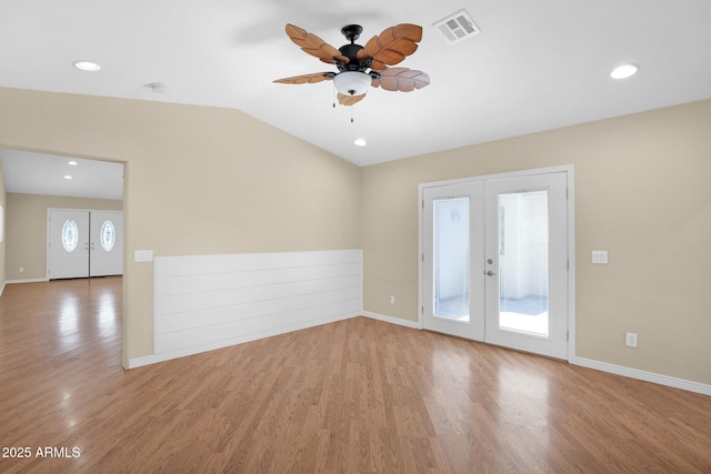 4112 N 4th Ave, Phoenix, AZ 85013 - empty room with ceiling fan, french doors, wood finished floors, lofted ceiling, and baseboards