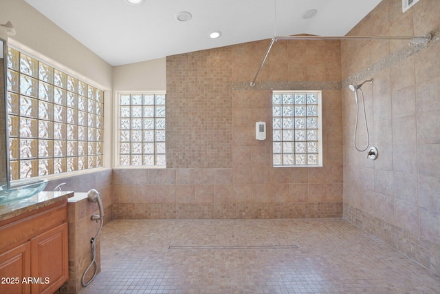 4112 N 4th Ave, Phoenix, AZ 85013 - full bath with vanity, tiled shower, healthy amount of natural light, lofted ceiling, and recessed lighting