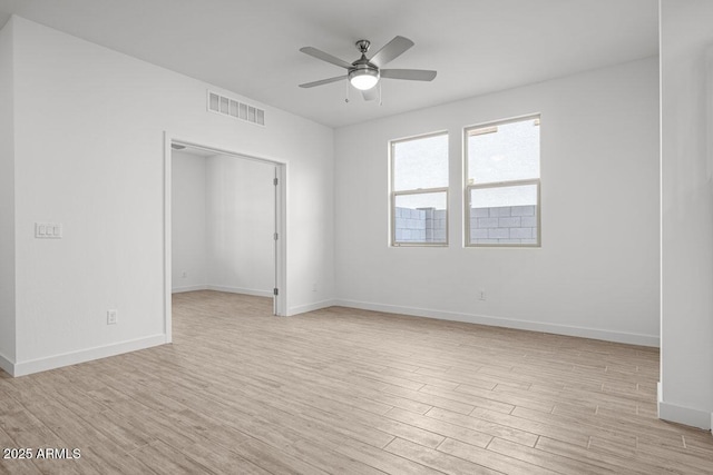 unfurnished bedroom featuring light wood-style floors, visible vents, ceiling fan, and baseboards