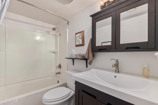 full bathroom featuring vanity, toilet, a textured ceiling, and shower / washtub combination