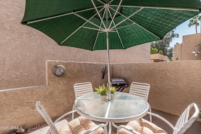 view of patio with a grill