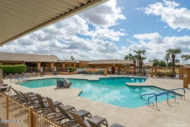 view of swimming pool featuring a patio area