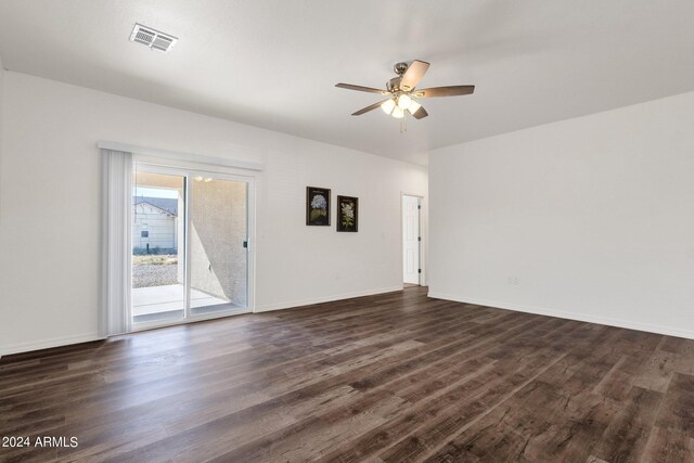 unfurnished living room featuring ceiling fan and dark hardwood / wood-style flooring