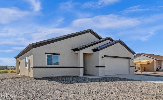 view of front of property with a garage