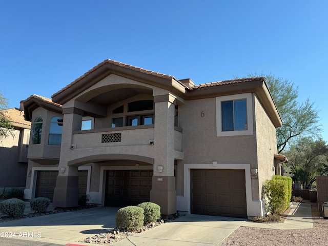 view of front of house with a balcony and a garage