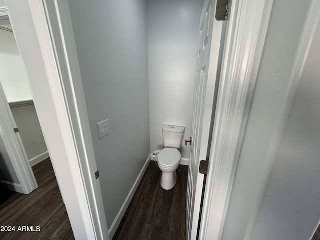 14000 N 94th St Unit 1037, Scottsdale, AZ 85260 - bathroom with wood finished floors, toilet, and baseboards