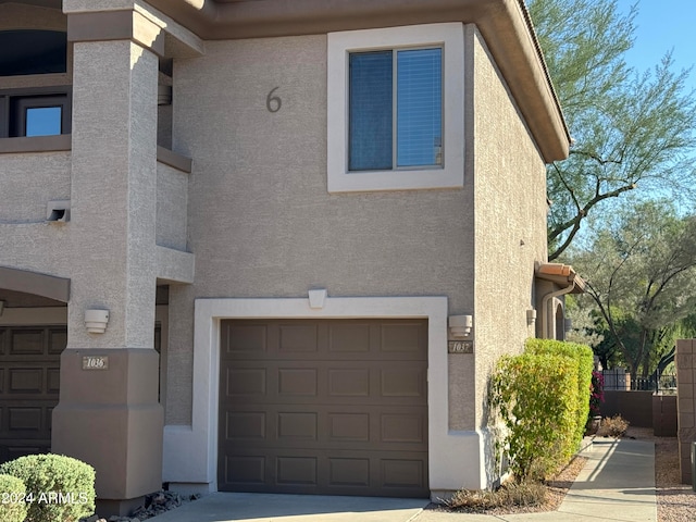 view of side of home with a garage