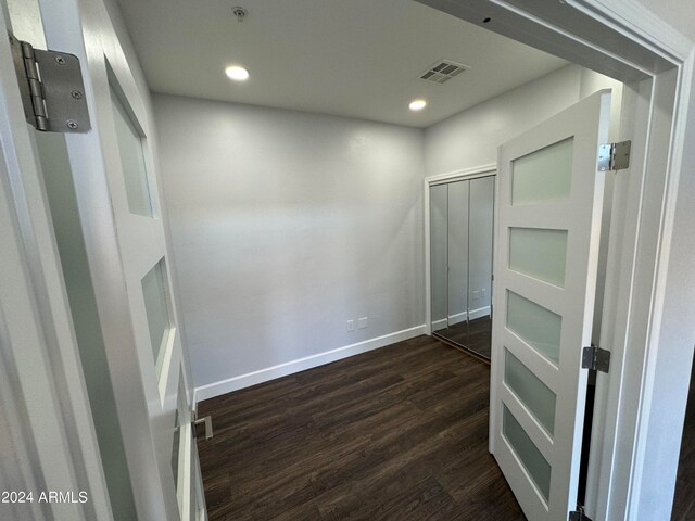 interior space with dark hardwood / wood-style flooring