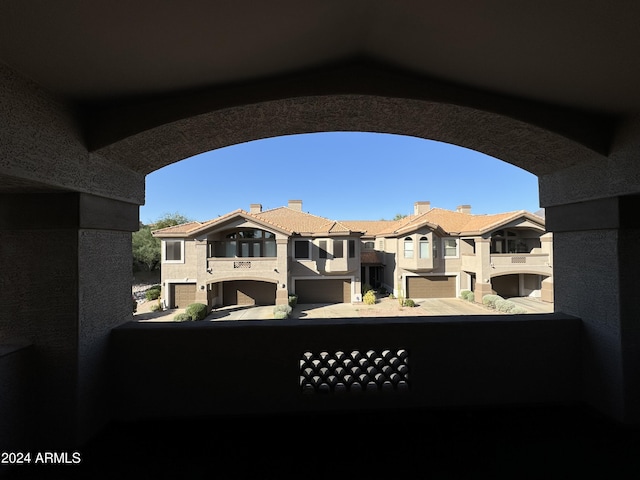 14000 N 94th St Unit 1037, Scottsdale, AZ 85260 - view of patio / terrace featuring a garage, a balcony, and a residential view