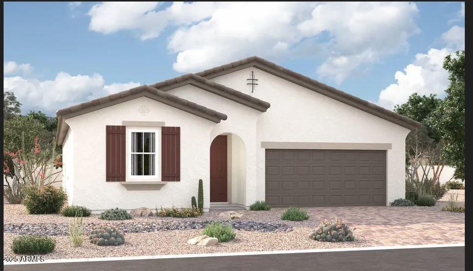5022 W Hardtack Trl, Laveen, AZ 85339 - view of front facade with an attached garage, stucco siding, and driveway