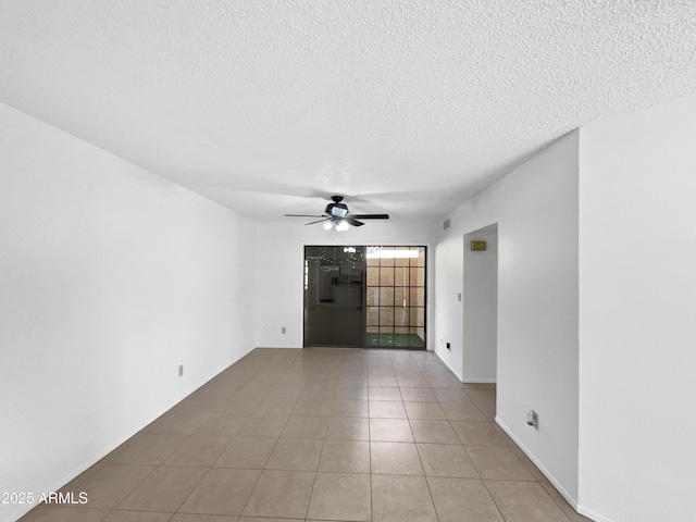 12342 S Shoshoni Dr, Phoenix, AZ 85044 - empty room featuring ceiling fan, a textured ceiling, and light tile patterned flooring