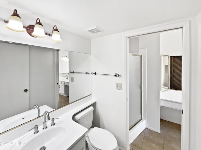 12342 S Shoshoni Dr, Phoenix, AZ 85044 - full bathroom featuring a stall shower, toilet, tile patterned floors, and vanity