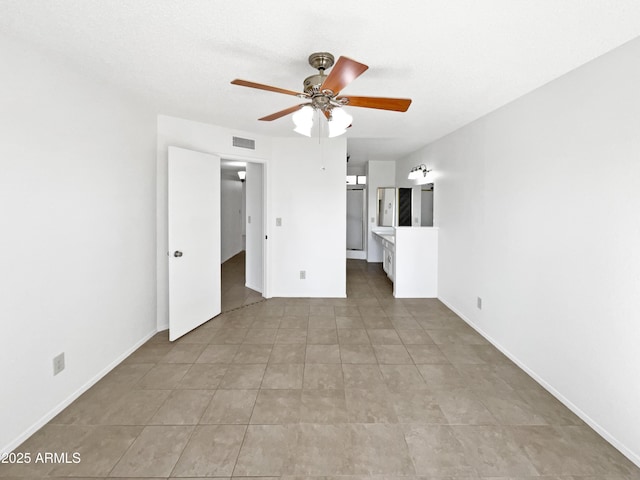 12342 S Shoshoni Dr, Phoenix, AZ 85044 - unfurnished bedroom with connected bathroom, tile patterned floors, and a ceiling fan